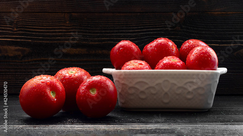 Juicy Red Tomatoes still life on dark background