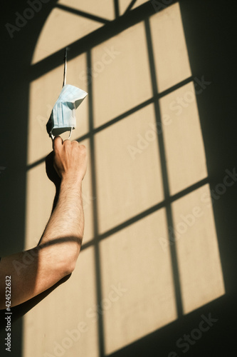 desperate person with mask at home due to the closure of the pandemic in times of covid. quarantine