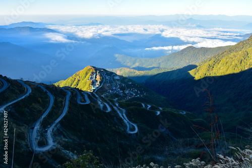 Mountain peak with ridges and cloud