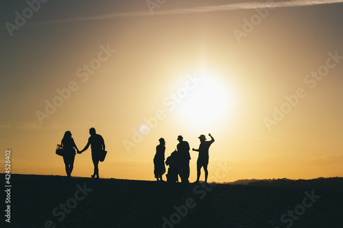 silhouette of a family at sunset