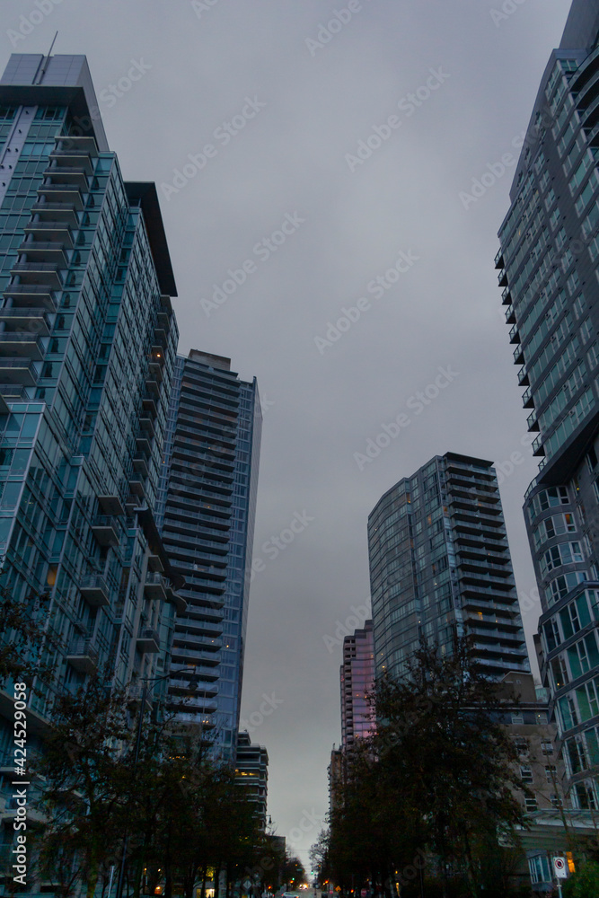City skyscrapers view from the road, on a rainy day, in Coal Harbour, Vancouver, BC
