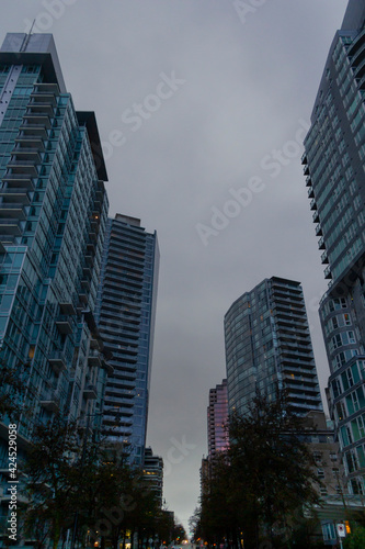 City skyscrapers view from the road, on a rainy day, in Coal Harbour, Vancouver, BC