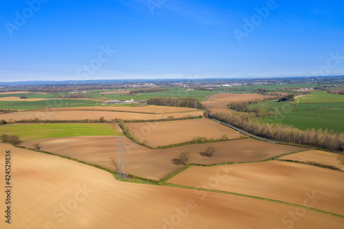 Aerial photo of a beautiful farmers field in the spring time in the town of Wetherby in Leeds in the UK taken in the Spring timeeeds in the UK