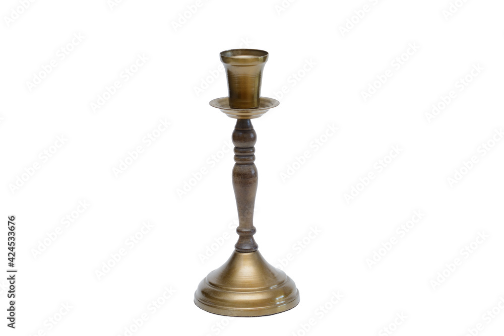 Vintage candlestick made of wood and brass. Piece of interior. Isolated on white background