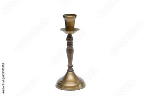 Vintage candlestick made of wood and brass. Piece of interior. Isolated on white background
