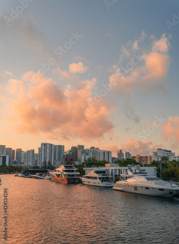 sunset over the river miami city boat clouds sky beautiful 