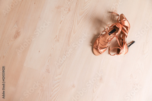 Women's shoes for latin dance and tango on the dance floor. Dance lessons.