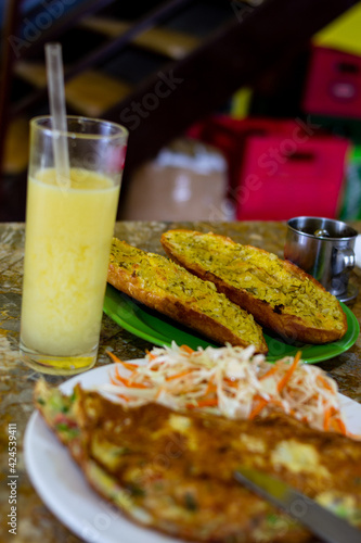 Garlic bread and omelet and salad breakfast. Vietnamese cuisine.