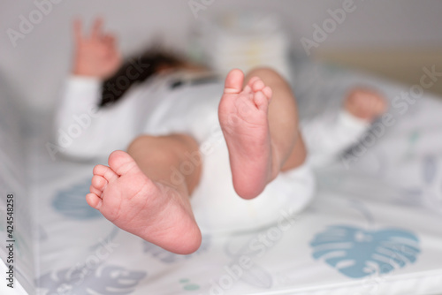 baby feet on a changing board