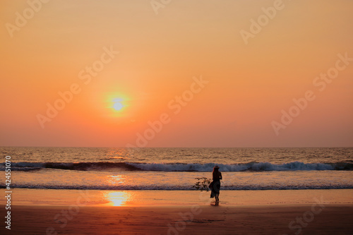 Focus on silhouette woman sunset beach holiday vacation lifestyle happiness freedom concept