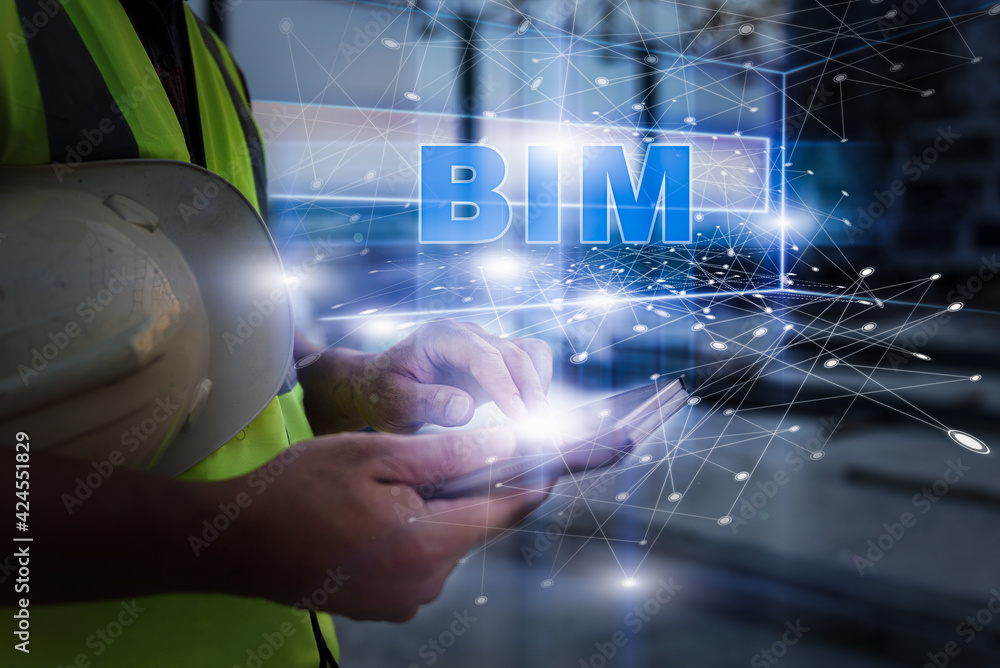 Fototapeta premium Engineering Consulting People on construction site holding tablet in his hand. Management in business workflow and Building inspector with BIM technology in Construction Project.