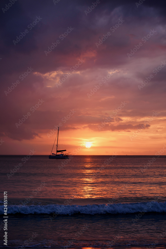 Silhouette of a luxurious yacht on the sea at sunset in Thailand Silhouette of a luxurious yacht on the sea at sunset in Thailand