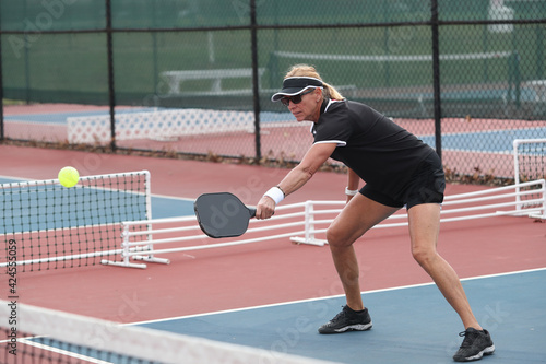 pickleball net play by an active senior
