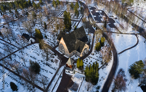 Obraz na płótnie Aerial view of the Espoo Cathedral in the cemetery on winter sunny day, Finland. w salonie