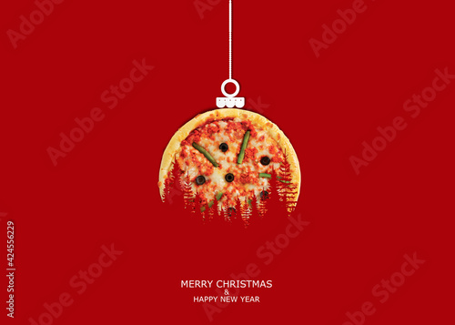 Pizza with Christmas and New Year concept. Isolated on Red Background.