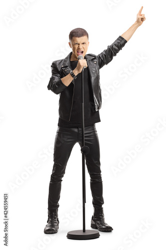 Full length portrait of a male teenage singer with a microphone photo