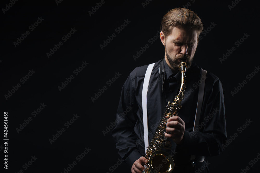 Fototapeta premium Man playing jazz on saxophone