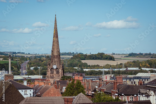 An elevated landscape view over the town centre of Rotherham, showing the rooftops with steeple and spire of the gothic Minster All Saints church