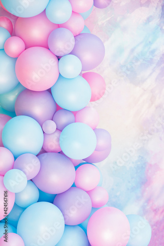 Colorful balloons background, punchy pastel colored and soft focus. pink and mint balloons photo wall birthday decoration. Pink background Copy space. Web banner. Wedding party.