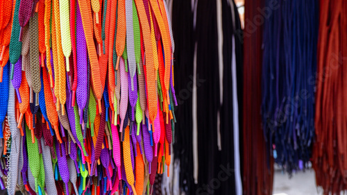Bright colorful shoelaces at a street market in Valencia