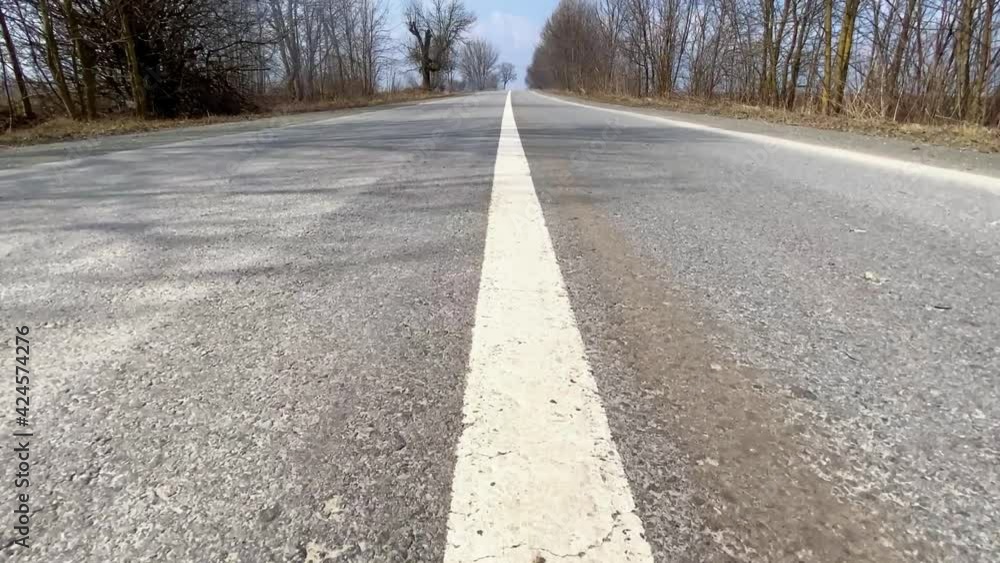 slow motion along countryside road at springtime slow motion along countryside road at springtime