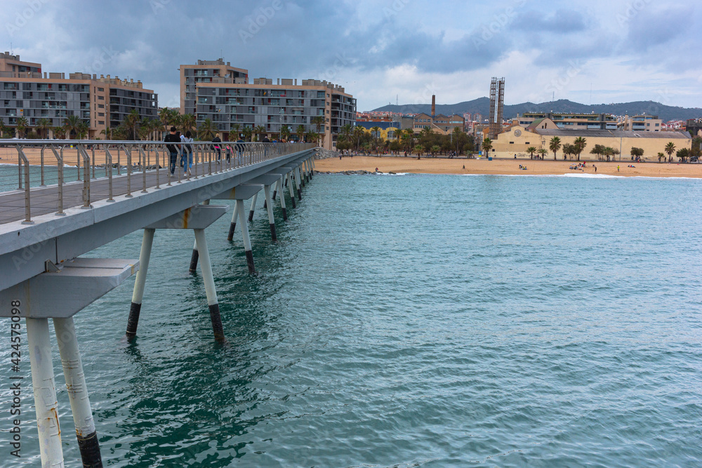 Bridge over the sea on the coast of Barcelona Mediterranean Sea