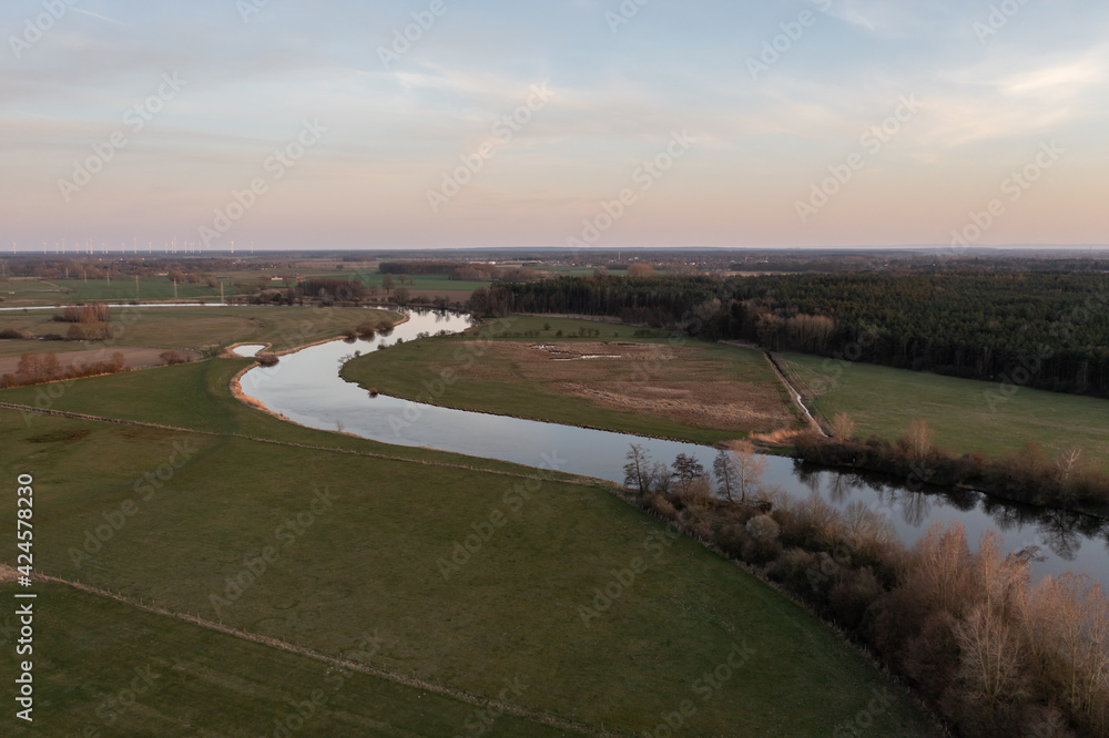 aerial view on landscape with river at sunset