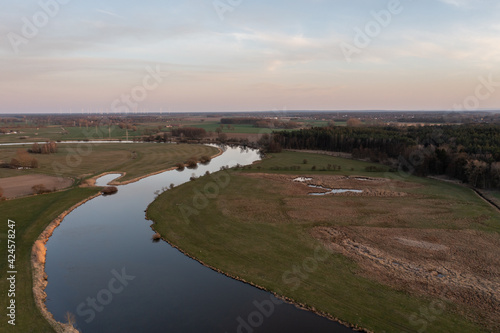 aerial view on landscape with river at sunset © JS_Fotoworx