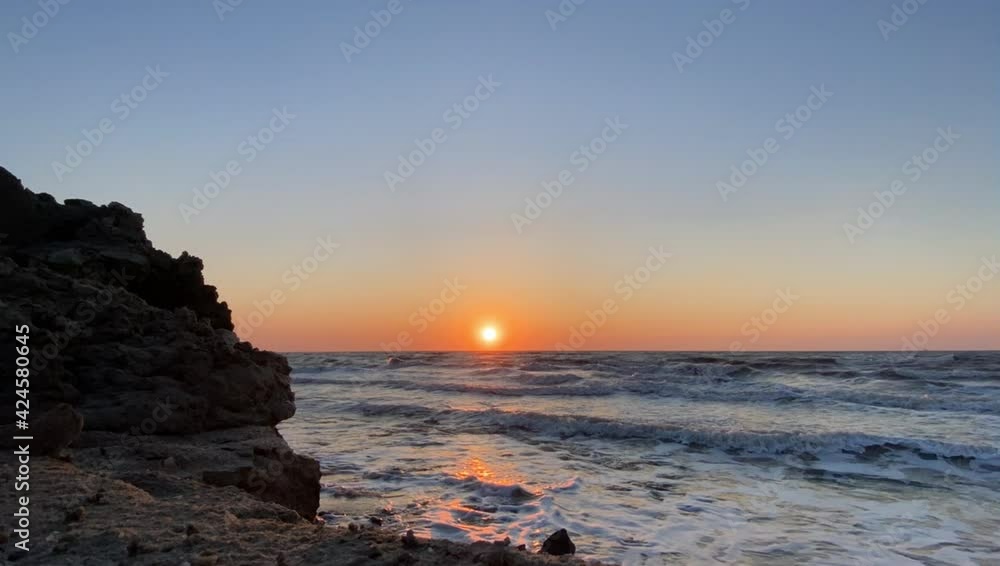 Stunning panoramic view of durres bay against horizon with sunset and orange sky Stunning panoramic view of durres bay against horizon with sunset and orange sky