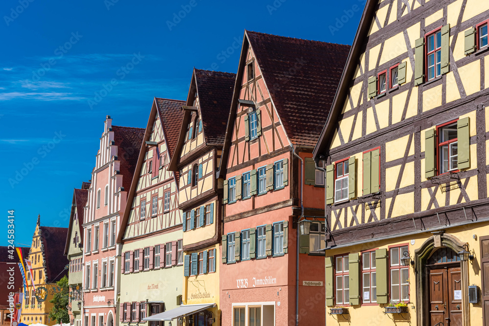 DINKELSBUHL, GERMANY, 27 JULY 2020: Colorful and ancient half-timbered houses in the historic center