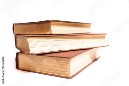 Three old vintage books isolated on white background