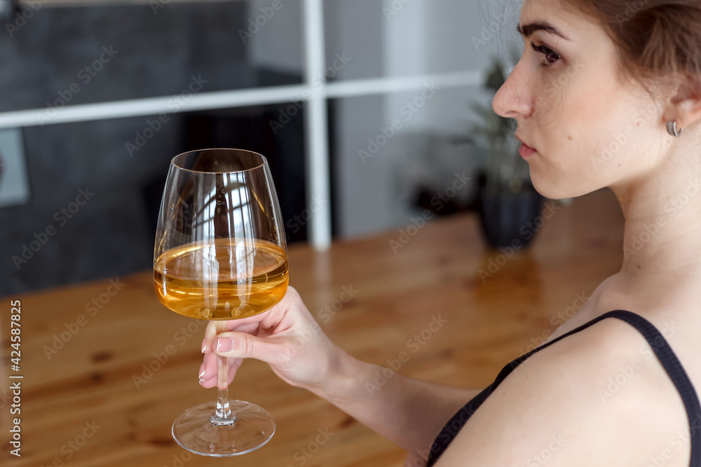 woman enjoying glass of white wine woman enjoying glass of white wine
