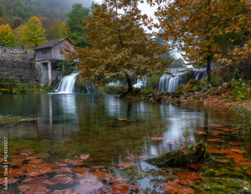 autumn by the old mill and waterfalls