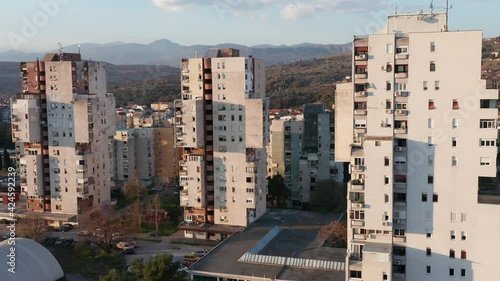 High-rise apartment buildings in a big city: residential skyscrapers, urban density and planning. Public housing project - flat complex in the form of a tower block in Podgorica, Montenegro, Europe. photo