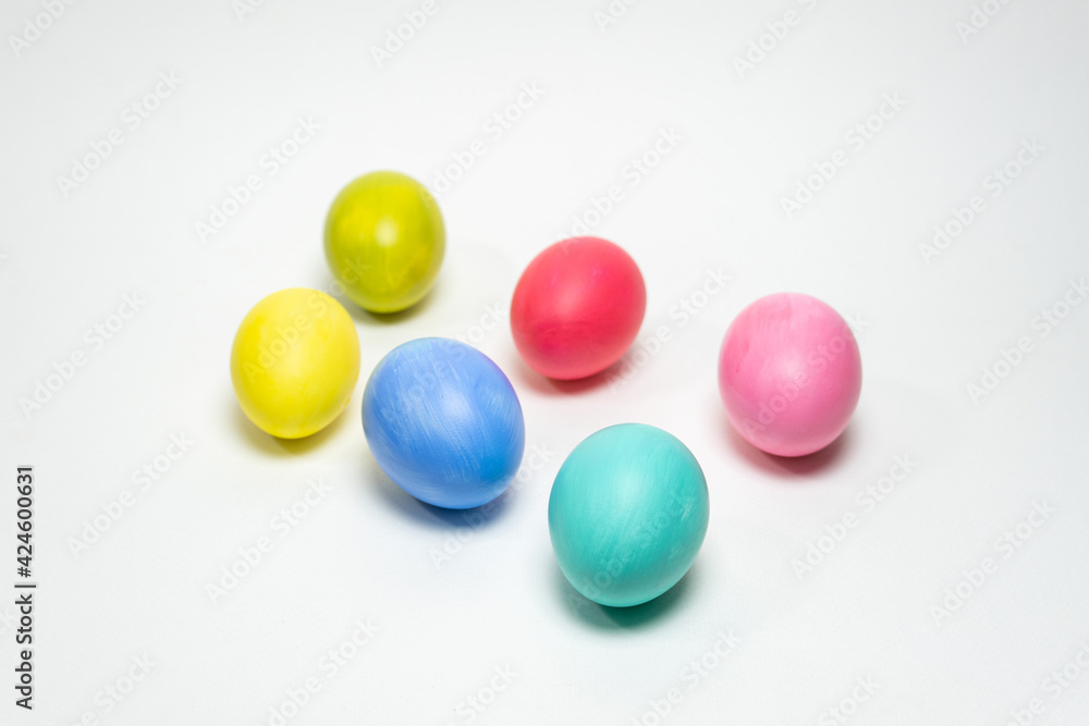 Six colorful eggs on white background. Selective focus. Creative Easter background Six colorful eggs on white background. Selective focus. Creative Easter background