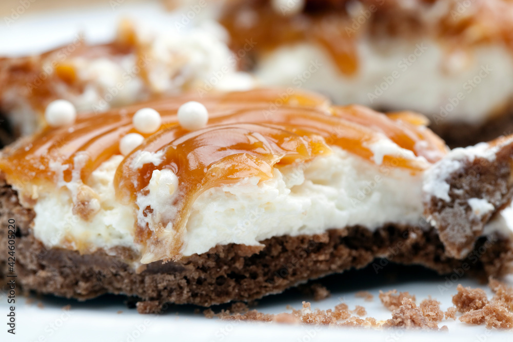 tartlet with milk cheese filling and lots of salted caramel with nuts