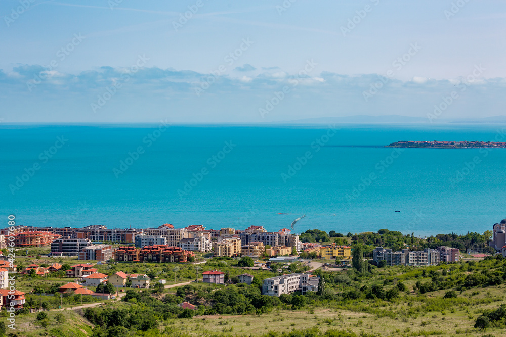 Sea village of Obzor at Black Sea, sunny moody spring day, high angle view from above with the blue water. Bulgaria, travel photograph