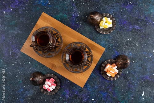 Top view of Two glass tea and candies photo