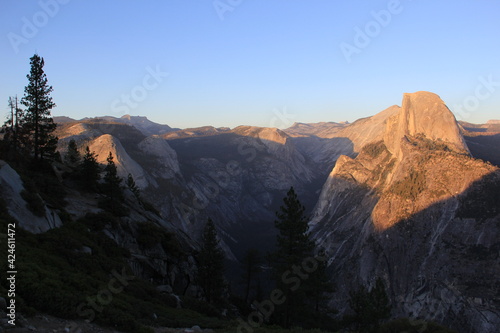 Western road trip sunset view of Half Dome from Glacier Point in Yosemite National Park, California