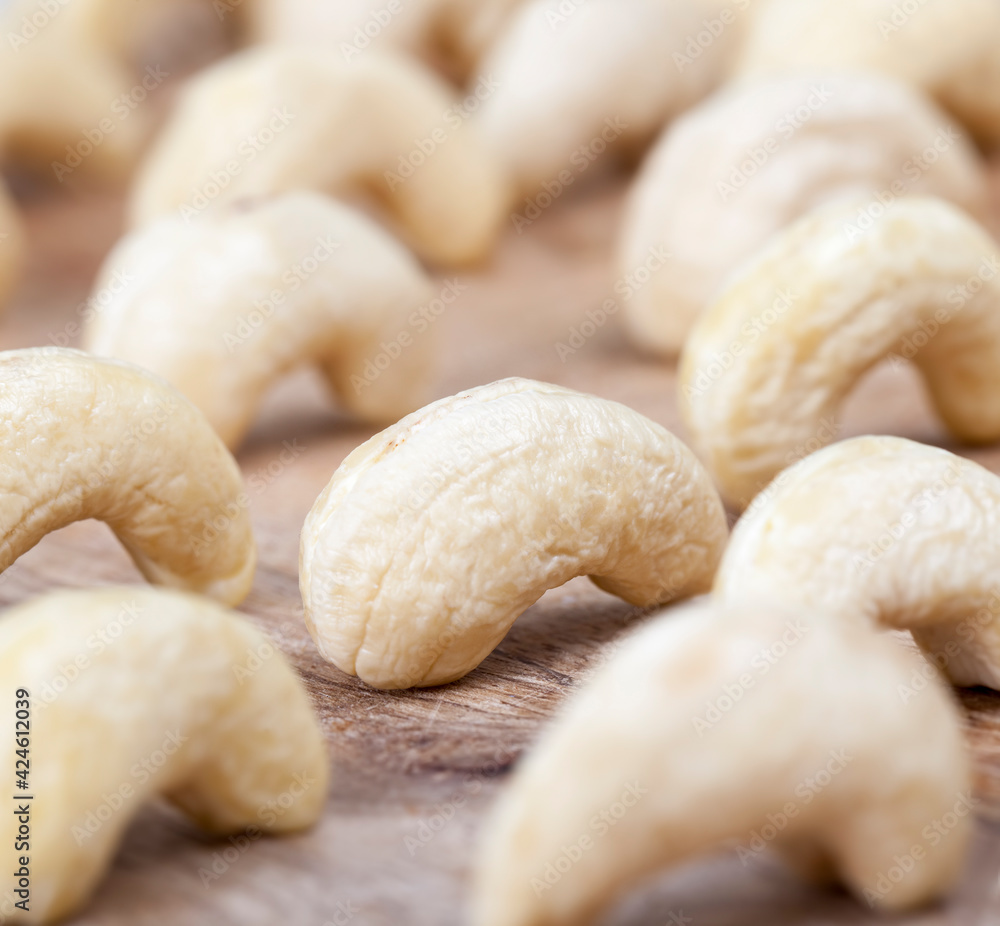 fresh raw cashew nuts on the kitchen table fresh raw cashew nuts on the kitchen table
