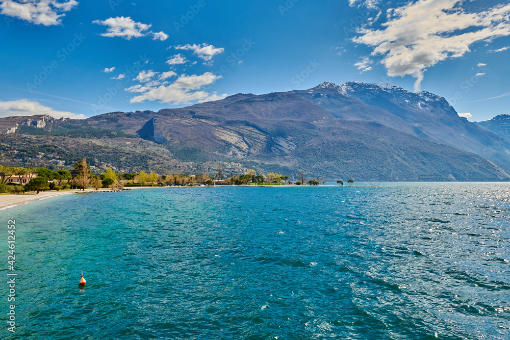Fototapeta premium View of the beautiful Lake Garda Asurrounded by mountains, Garda lake in the spring time,Trentino alto Adige region,italy