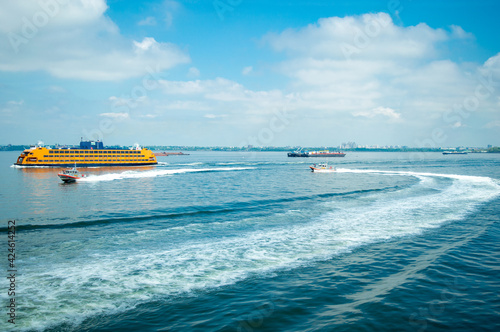 Staten Island Ferry and Lower Manhattan Skyline, New York City, USA.