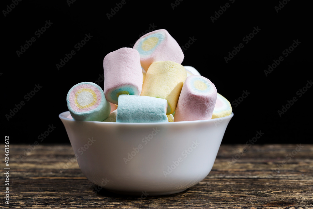 marshmallow is made in different colors of cylindrical shape marshmallow is made in different colors of cylindrical shape