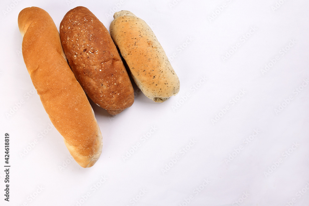 Freshly baked bread loaf bun roll round long mix verity copy text space border frame white background Freshly baked bread loaf bun roll round long mix verity copy text space border frame white background