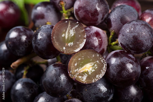Closeup cut half of purple grape