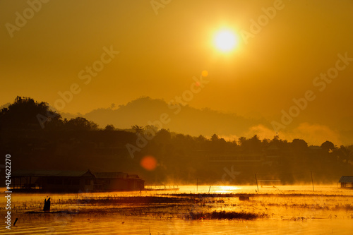 Orange Sun up to Sunrise over mountain and reflect on river morning