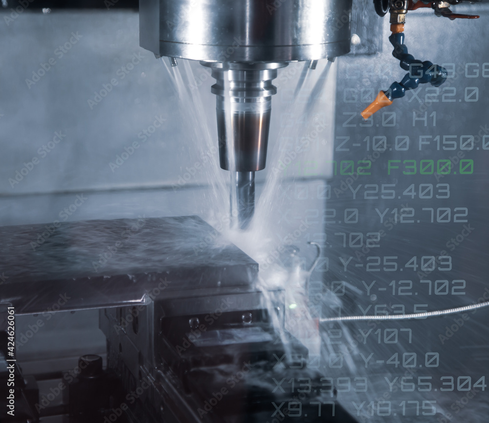 Fototapeta premium CNC milling machine cutting workpiece with coolant. CNC programming code. Industrial manufacturing metalwork 