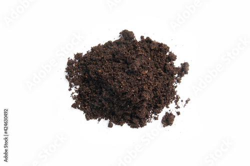 a pile of black earth on a white background isolated on a white background top view