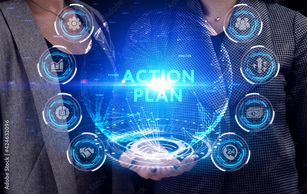Business, Technology, Internet and network concept. Young businessman working on a virtual screen of the future and sees the inscription: Action plan Business, Technology, Internet and network concept. Young businessman working on a virtual screen of the future and sees the inscription: Action plan