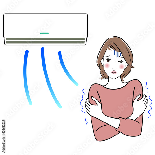 A woman shivering since the air conditioner is too strong